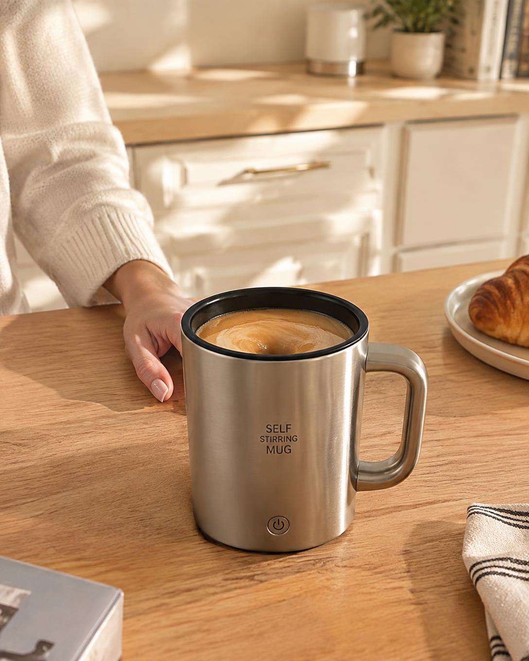 Automatic self-stirring coffee cup mixing a latte on a kitchen counter